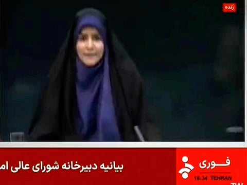 This frame grab from a video released by Iran state TV shows anchor Sahar Emami amid an explosion from an Israeli attack during a live TV broadcast in Tehran, Iran.