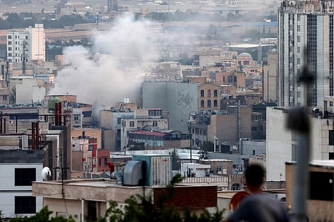 Smoke billows from an explosion in southwest Tehran.