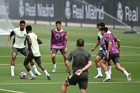 Real Madrid's English midfielder Jude Bellingham (L) and Brazilian forward Rodrygo (2nd-L) fight for the ball in a training session at the Gardens North County District Park, Palm Beach Gardens, Florida on June 1.