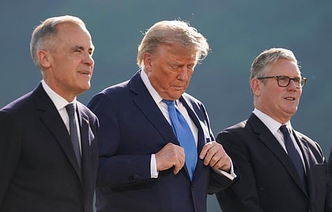 Canadian Prime Minister Mark Carney, US President Donald Trump and British Prime Minister Keir Starmer pose for a photo during the G7 Summit at the Kananaskis Country Golf Course in Kananaskis, Alberta, Canada on June 16, 2025.