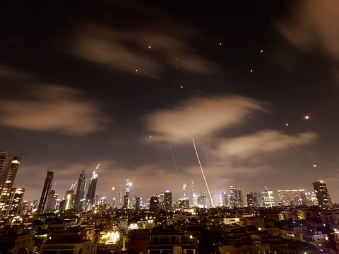 Israeli air defence systems light up the night sky as they intercept incoming Iranian missiles over Tel Aviv in the early hours of June 18, 2025. The interception follows escalating tensions between the two nations, marking a significant moment in the ongoing conflict. Residents reported loud explosions as the defence system successfully neutralized multiple threats.