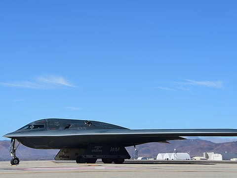 A B-2 Stealth Bomber pulls up on the runway after landing at the Palmdale Aircraft Integration Center of Excellence in Palmdale, California on July 17, 2014, where the US Air Force and manufacturer of the B-2, Northrop Grumman, celebrated the 25th anniversary of the B-2 Stealth Bomber's first flight.