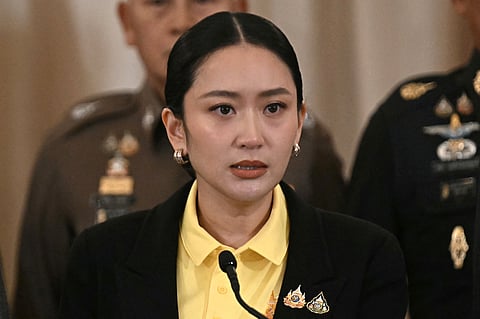 Thailand's Prime Minister Paetongtarn Shinawatra speaks during a press conference surrounded by senior Thai army commanders and government minsters at Government House in Bangkok on June 19, 2025.
