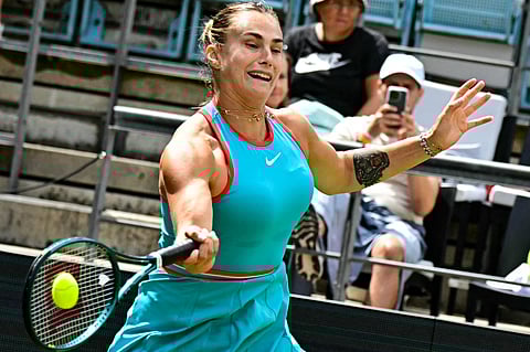 Belarus' Aryna Sabalenka returns a ball to Spain's Rebeka Masarova in their women's singles tennis match during the Berlin Open on June 19, 2025. The match was halted the previous day due to poor light and dew.