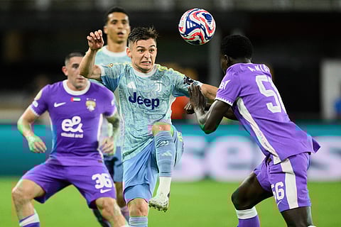 Juventus' Francisco Conceicao and Al Ain's Amadou Niang (right) compete for the ball during the Club World Cup Group G football match against Al Ain in Washington, Wednesday, June 18, 2025.