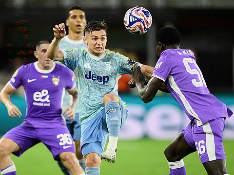 Juventus' Francisco Conceicao and Al Ain's Amadou Niang, right, compete for the ball during the Club World Cup group G soccer match between Al Ain and Juventus in Washington.