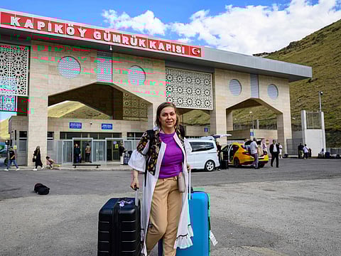 Homa, a 40-year-old Iranian, arrives in Turkey through the Razi-Kapiköy border crossing, north-eastern Turkey. Flights to Iran were suspended on June 18, 2025 after Israel launched an attack on Tehran's nuclear facilities, sparking a deadly confrontation.