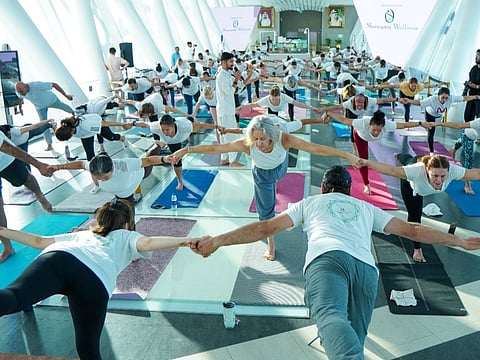 UAE wants its own global yoga brand: Yoga enthusiasts take part in an event held as part of the International Day of Yoga at Dubai Frame on Friday.