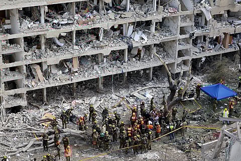 Israeli security forces and first responders gather at the site of an Iranian strike that hit a residential neighbourhood in the Ramat Aviv area in Tel Aviv on June 22, 2025.