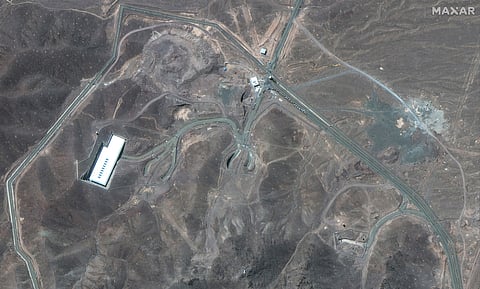 This satellite image provided by Maxar Technologies shows vehicles at Fordo enrichment facility in Iran on Thursday, June 19, 2025. (Maxar Technologies via AP)