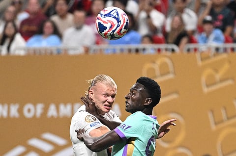Manchester City's Erling Haaland and Al Ain's Amadu Niang fight for the ball during the FIFA Club World Cup 2025 Group G football match in Atlanta on June 22, 2025.