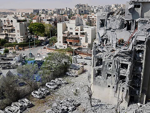 Emergency workers check the damage caused to a building from an Iranian missile strike in Beersheba in southern Israel on June 24, 2025.