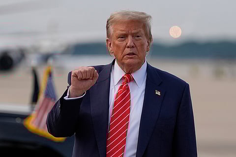 President Donald Trump gestures after arriving on Air Force One, Wednesday, June 25, 2025, at Joint Base Andrews, Md.