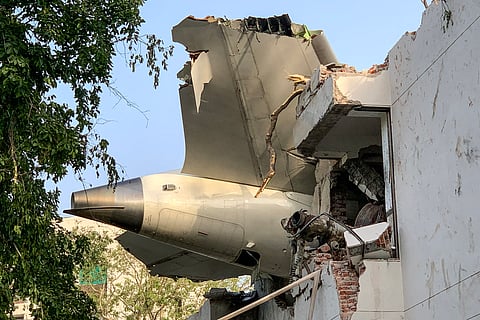 The tail of Air India flight 171 is pictured after it crashed in a residential area near the airport in Ahmedabad on June 12, 2025.