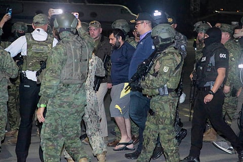Escorted by soldiers and police officers, Adolfo "Fito" Macias, the leader of the Choneros gang, arrives in Guayaquil, Ecuador, after getting detained, Wednesday, June 25, 2025.