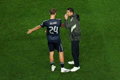 Dean Huijsen #24 of Real Madrid C.F. speaks with Xabi Alonso, Head Coach of Real Madrid C.F., during a hydration break during the FIFA Club World Cup 2025 group H match between FC Red Bull Salzburg and Real Madrid CF at Lincoln Financial Field on June 26, 2025 in Philadelphia, Pennsylvania.