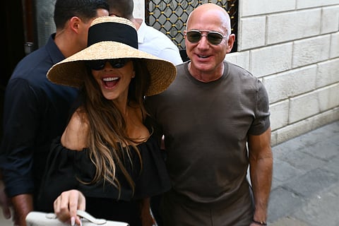 Amazon's founder Jeff Bezos and his wife Lauren Sanchez Bezos leave the Harry's Bar restaurant a day after their wedding in Venice on June 28, 2025.