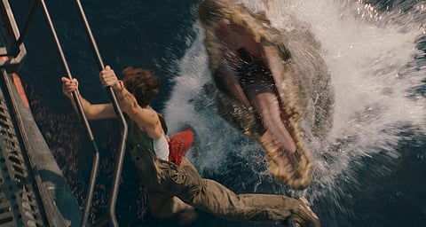 This image released by Universal Pictures and Amblin Entertainment shows Philippine Velge in a scene from " Jurassic World: Rebirth." (Jasin Boland/Universal Pictures and Amblin Entertainment via AP)