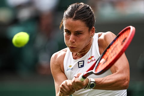 US player Emma Navarro returns the ball to Czech Republic's Petra Kvitova during their women's singles first round tennis match on the second day of the 2025 Wimbledon Championships at The All England Lawn Tennis and Croquet Club in Wimbledon, southwest London, on July 1, 2025.