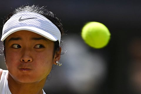 Philippines' Alexandra Eala eyes the ball as she plays against Czech Republic's Barbora Krejcikova in the first round at Wimbledon Championships.