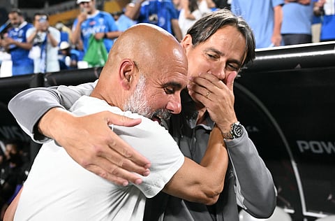 Manchester City's Spanish head coach Pep Guardiola and Al Hilal's Italian head coach Simone Inzaghi chat during the Fifa Club World Cup 2025 round of 16 football match at the Camping World stadium in Orlando on June 30, 2025.
