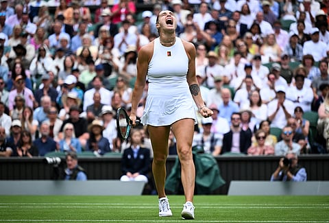 Belarus's Aryna Sabalenka celebrates after winning a point against Czech Republic's Marie Bouzkova during their women's singles second round tennis match on the third day of the 2025 Wimbledon Championships at The All England Lawn Tennis and Croquet Club in Wimbledon, southwest London, on July 2, 2025.