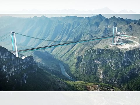Huajiang Grand Canyon Bridge stands 625 metres above the Beipan River. Its steel trusses weigh around 22,000 metric tonnes — equivalent to three Eiffel Towers — underscoring the massive scale and engineering complexity of the project.