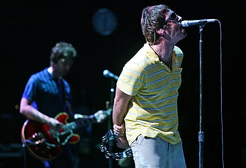 British Liam (R) and Noel Gallagher, members of group "Oasis" perform during their concert at the Benicasim International Festival in Benicasim, Castellon, August 7, 2005.