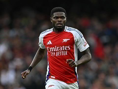 Arsenal's Ghanaian midfielder #05 Thomas Partey runs with the ball during the English Premier League football match between Arsenal and Bournemouth at the Emirates Stadium in London on May 3, 2025.