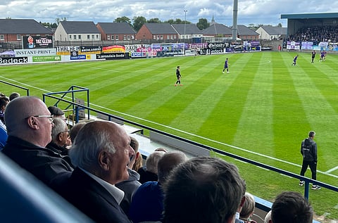 Crowds look on as a football match takes place in Lurgan, Northern Ireland on July 6, 2025.