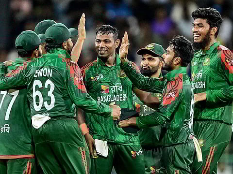 Bangladesh's Tanvir Islam (C) celebrates with teammates after taking the wicket of Sri Lanka's Kamindu Mendis during the second ODI at the R. Premadasa International Cricket Stadium in Colombo on July 5, 2025.