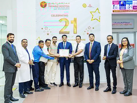 Akbar Moideen Thumbay, Vice President of Thumbay Healthcare, honours the team for their honesty and dedication in returning a lost bag containing Dh32,000.