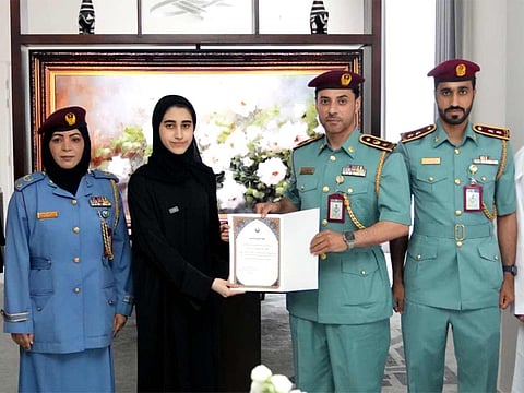 Mahra Abdullah Al Hamr Al Ali is honoured by RAK Police.