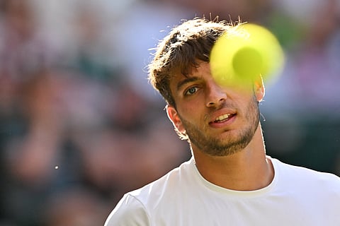 Italy's Flavio Cobolli eyes the ball as he plays against Serbia's Novak Djokovic during their men's singles quarter-finals in London on Wednesday.