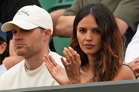 Eiza Gonzalez, the girlfriend of Grigor Dimitrov of Bulgaria watches as he plays Sebastian Ofner of Austria during a third round men's singles match at the Wimbledon Tennis Championships in London, Saturday, July 5, 2025.