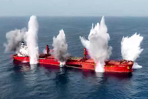 This handout picture released by Yemen's Houthi Ansarullah Media Centre on July 8, 2025 shows a view of explosions on the Liberia-flagged bulk carrier Magic Seas, which was attacked by Houthi-affiliated militants at sea.