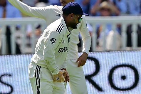 India's Rishabh Pant reacts after having hurt his hand while keeping wicket on the opening day of the third Test at Lord's.