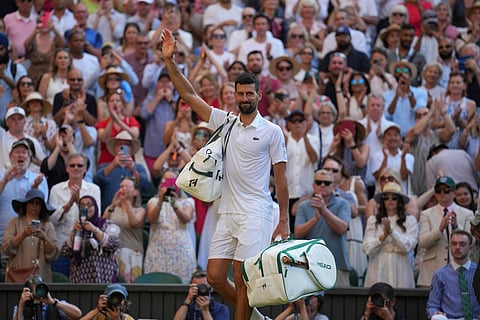 Serbia's Novak Djokovic leaves the court after losing to Italy's Jannik Sinner in a men's singles semifinal at the Wimbledon Tennis Championships in London, Friday, July 11, 2025.