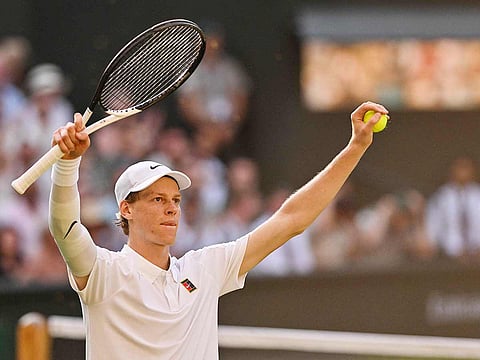 Italy's Jannik Sinner celebrates after victory over Serbia's Novak Djokovic during their men's singles semi-final tennis match of the 2025 Wimbledon Championships at The All England Lawn Tennis and Croquet Club in Wimbledon, southwest London, on July 11, 2025.