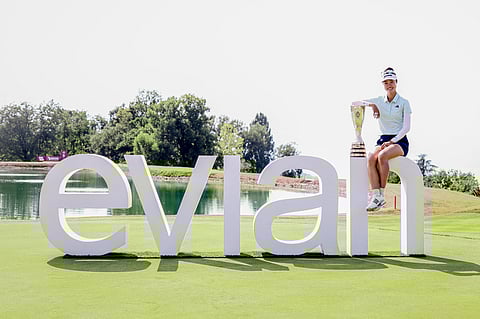 Australia's Grace Kim poses with the trophy after her victory on the first playoff hole after the final round of the Amundi Evian Championship at Evian Resort Golf Club, in Evian-Les-Bains, eastern France on July 13, 2025.
