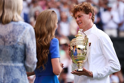 Italy's Jannik Sinner receives from the hands of Britain's Catherine, Princess of Wales the winner's trophy following his victory against Spain's Carlos Alcaraz at the end of their men's singles final tennis match on the fourteenth day of the 2025 Wimbledon Championships at The All England Lawn Tennis and Croquet Club in Wimbledon, southwest London, on July 13, 2025.