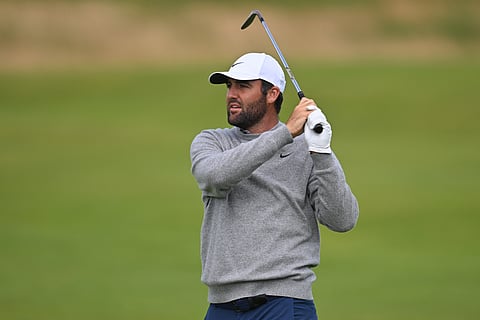 US golfer Scottie Scheffler watches his approach shot from the 18th fairway during practice ahead of the 153rd Open Championship at Royal Portrush golf club in Northern Ireland on July 14, 2025.
