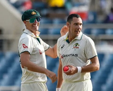 Australian pacer Scott Boland celebrates a wicket with skipper Pat Cummins during the third Test against the West Indies on Sunday.