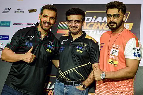 India's former cricket captain Sourav Ganguly (C) with actors John Abraham (L) and Arjun Kapoor