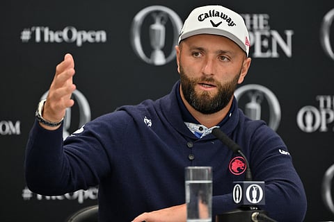 Spain's Jon Rahm gestures during a press conference held ahead of the 153rd Open Championship at Royal Portrush golf club in Northern Ireland on July 15, 2025.
