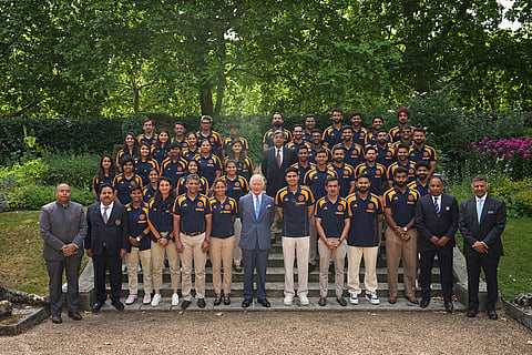 Britain's King Charles III poses with members of the India men's and women's Test cricket teams during an audience in the gardens of Clarence House, London on July 15, 2025.