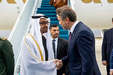 Sheikh Mohamed bin Zayed Al Nahyan is received by Alparslan Bayraktar, Minister of Energy and Natural of Turkey (R), upon arriving at Esenboga International Airport.