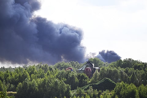 Smoke caused by a fire billows above the site of the Tomorrowland electronic music festival in Boom, northern Belgium, on July 16.