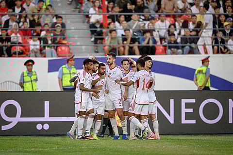 UAE players celebrate the goal during the AFC World Cup qualifiers against Kyrgyzstan. The 1-1 draw left UAE in third place and a place in the playoffs.
