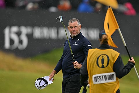 England's Lee Westwood reacts on the 18th green after completing his 2-under par 69 on the opening day of the 153rd Open Championship at Royal Portrush golf club in Northern Ireland on July 17, 2025.